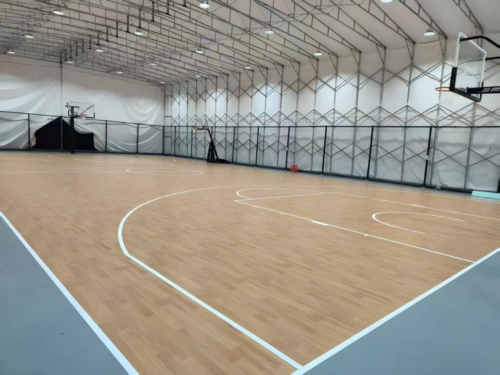 Indoor basketball court PVC sports flooring installation in professional gymnasium