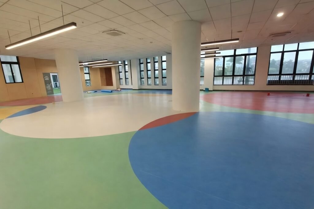 Multi-layer commercial PVC flooring installed in education multipurpose space