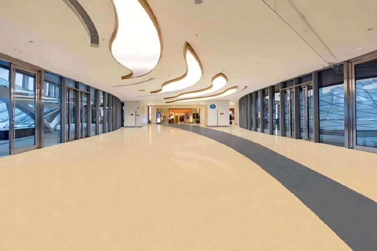 Multi-layer commercial PVC flooring installed in shopping mall corridor